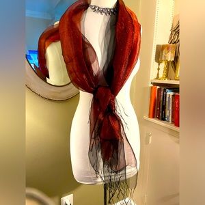 Metallic Rich berry and black colored scarf. Fringe ends.